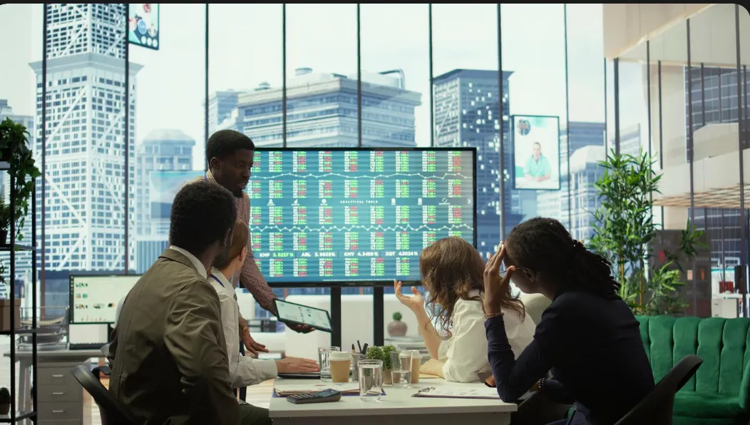 bunchof business expats looking at the screen of golden visa approval.